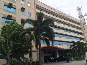 a palm tree in front of a building at El Cielito Inn - Sta. Rosa in Santa Rosa