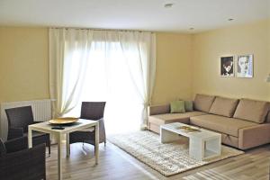 a living room with a couch and a table at Apartment house Der Krauterhof Drei Annen Hohne in Drei Annen Hohne