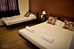 Postel nebo postele na pokoji v ubytování Cleon Villas Pension