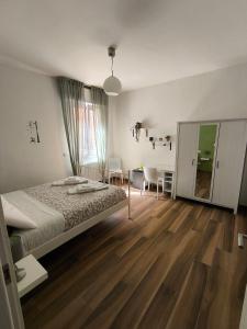 a bedroom with a bed and a dining room at B&B Monzuno-Sulla Via degli Dei in Monzuno