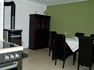 a kitchen with a table and chairs and a stove at Holiday apartment Diana in Oberstaufen