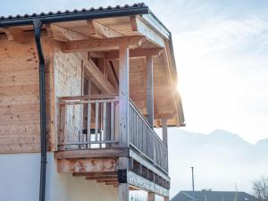 a balcony on the side of a house at Inzell Chalets with private pool in Inzell