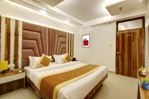 Postel nebo postele na pokoji v ubytování Hotel Star Villa - Front of New Delhi Railway Station & 5 Minute from Connaught Place