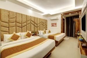 Postel nebo postele na pokoji v ubytování Hotel Star Villa - Front of New Delhi Railway Station & 5 Minute from Connaught Place + 37 fotografií