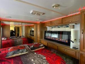 a train room with two beds and a flat screen tv at Romantic getaway in Decatur