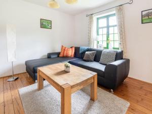 a living room with a couch and a coffee table at Lovely Holiday Home in Zierow with Terrace in Zierow