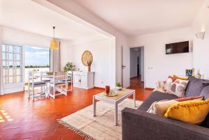 a living room with a couch and a table at Quinta Terruta by Ocvillas in Albufeira