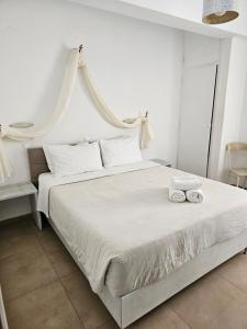 Ένα ή περισσότερα κρεβάτια σε δωμάτιο στο Hotel Leta 