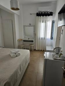 Ένα ή περισσότερα κρεβάτια σε δωμάτιο στο Hotel Leta 