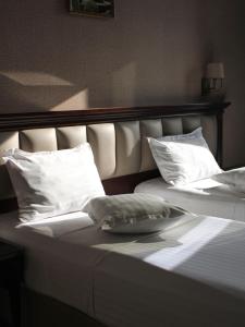 Voodi või voodid majutusasutuse Konyak Hotel toas