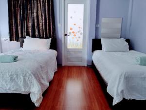 Postel nebo postele na pokoji v ubytování Mango Tree Guestroom