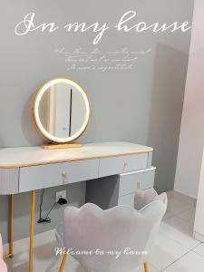 an image of a dressing table with a mirror at Vivi Homestay in Nilai