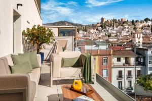 a balcony with a view of a city at Meliá Granada in Granada