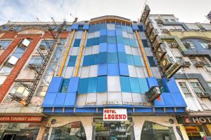 a tall blue building with scaffolding at Hotel Legend - Walk-In from New Delhi Railway Station in New Delhi