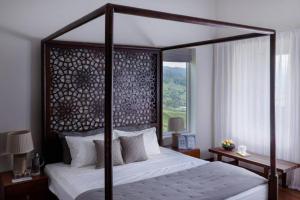 Postel nebo postele na pokoji v ubytování Nilgiri Valley Villa Ooty - a VKation Experience + 15 fotografií
