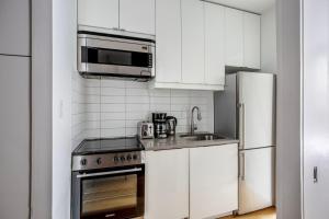 A kitchen or kitchenette at Classic LES 1br w wd nr SoHo NYC-646