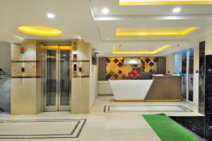 a lobby of a building with a reception desk at Hotel Delhi Fab - Near Connaught Place in New Delhi