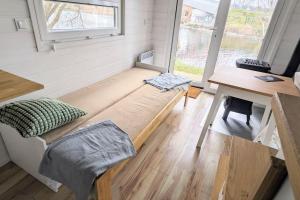 Ένα ή περισσότερα κρεβάτια σε δωμάτιο στο Tiny House Mila
