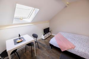 Posteľ alebo postele v izbe v ubytovaní LD-Location Hôtel