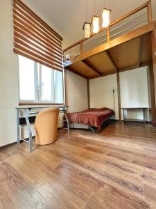 a room with a bed and a desk and a bunk bed at Cozy rooms in Old Town and Wawel in Kraków