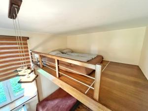 a bedroom with a bunk bed in a house at Cozy rooms in Old Town and Wawel in Krakow
