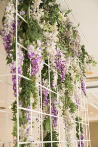 a bunch of purple and white flowers hanging from a ceiling at htop Amatista #htopBliss in Lloret de Mar