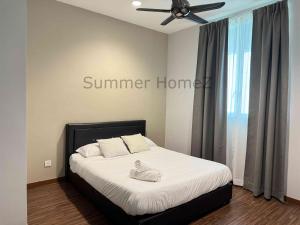 a bedroom with a bed with a ceiling fan at 3BR 5-6Pax Zetapark Setapak Central, Lake View in Kuala Lumpur