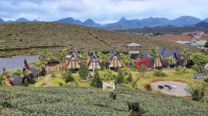 a model of a house on a hill at Thung Lũng Ba Đồi Chè in Mộc Châu