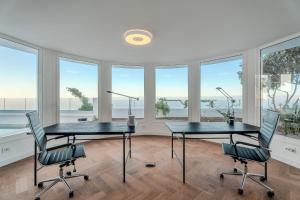 two tables and chairs in a room with windows at Karat Villa Sound of the Sea in Tacoronte +33 photos