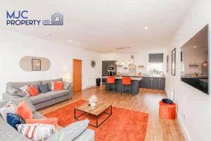 a living room with a couch and a table at Mansfield in Hawick