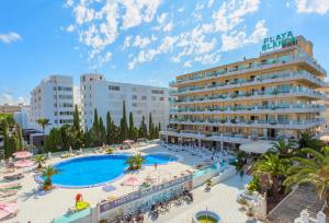 an aerial view of a hotel with a large pool at BJ Playa Blanca in Sa Coma