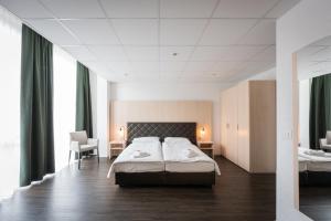 Postel nebo postele na pokoji v ubytování Los Lorentes Hotel Bern Airport
