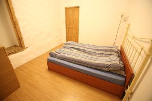 Postel nebo postele na pokoji v ubytování Viru Old Town Apartment