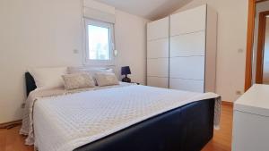 Ein Bett oder Betten in einem Zimmer der Unterkunft Apartment Oliva allegra