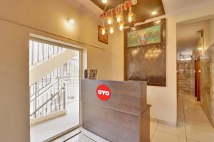 a door in a room with a stop sign on it at Hotel O IRA Comforts in Bengaluru