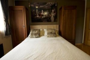 a bed with two pillows in a bedroom at Luxury Apartments Croatia in Banjole