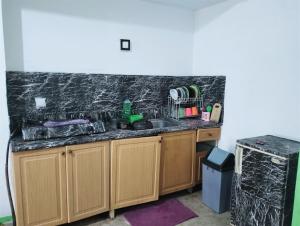 a kitchen with a sink and a counter at Hotel Lippo Carita bay Wanda01 in Carita