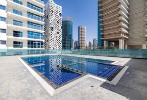 a swimming pool in the middle of a building at Lux BnB I AG Tower I Canal Views in Dubai