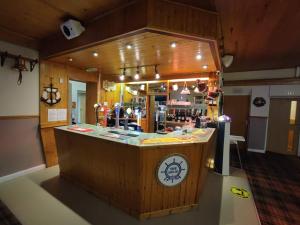 a store with a counter in the middle of a room at The Helm in Pembrokeshire