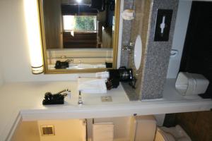 a bathroom with a sink and a mirror at Motel 6-Oklahoma City, OK - Bricktown in Oklahoma City