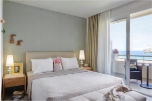 Giường trong phòng chung tại Afitis Boutique Hotel