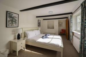 En eller flere senge i et værelse på Docklow House, By RentMyHouse