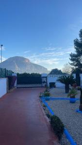 a walk way with a mountain in the background at 3 bedrooms villa with private pool enclosed garden and wifi at Valencia in Marchuquera