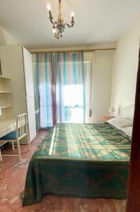 En eller flere senger på et rom på Hotel Loris - Valentini Family Village