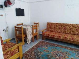 A television and/or entertainment centre at Anglo Chalets - Ageeba beach