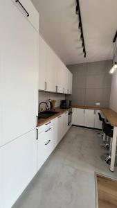 A cozinha ou cozinha compacta de CityCenterApartments/M32/8B