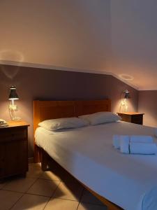 Postel nebo postele na pokoji v ubytování Hotel l'Etrusco - San Vincenzo
