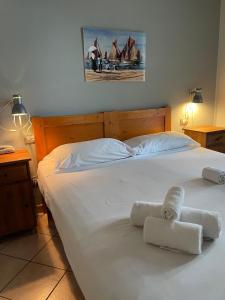 Postel nebo postele na pokoji v ubytování Hotel l'Etrusco - San Vincenzo