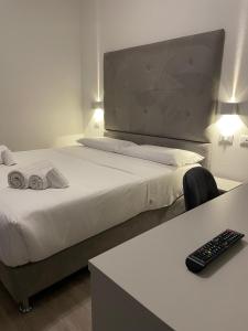 Postel nebo postele na pokoji v ubytování Hotel l'Etrusco - San Vincenzo