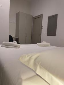 Postel nebo postele na pokoji v ubytování Hotel l'Etrusco - San Vincenzo